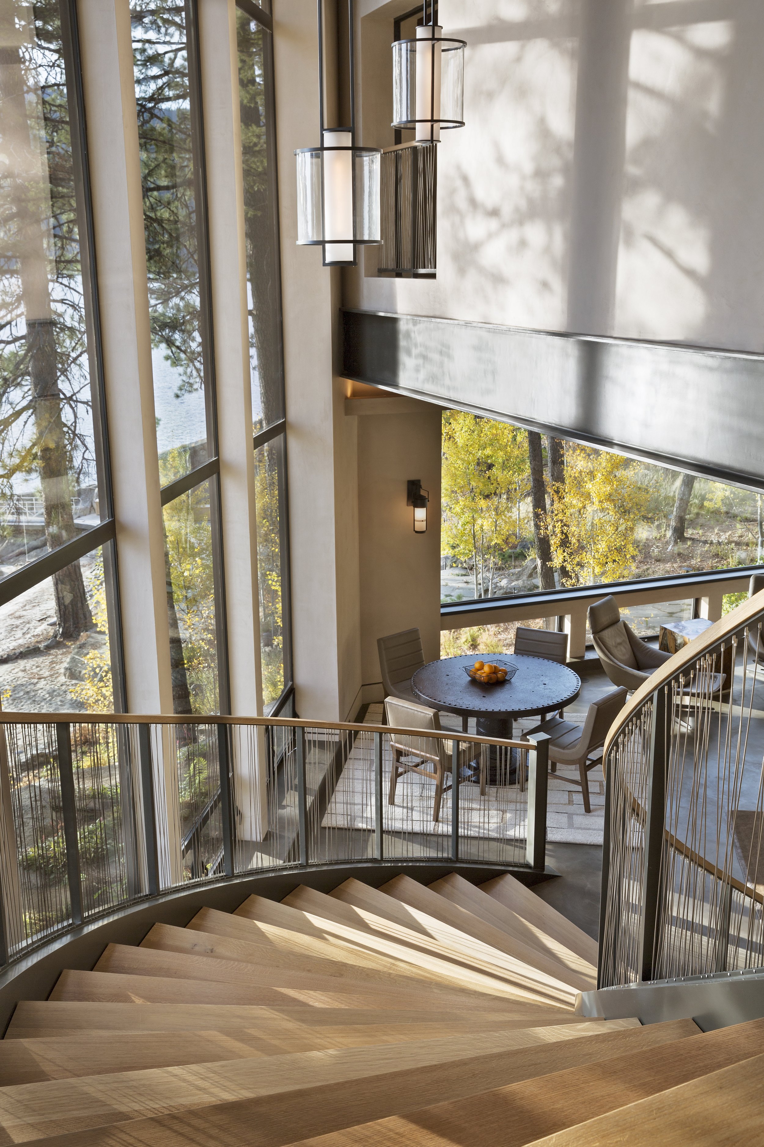 Curved Wooden Staircase with Scenic Views in Modern McCall, Idaho Home