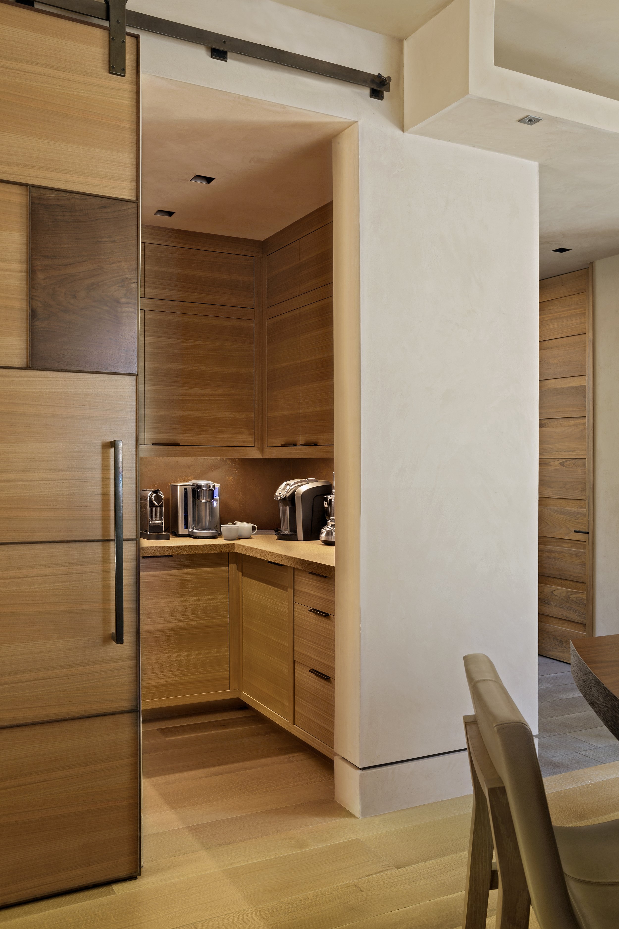 Modern Kitchen Pantry in McCall, Idaho Home with Light Wood Cabinetry and Metal Accents