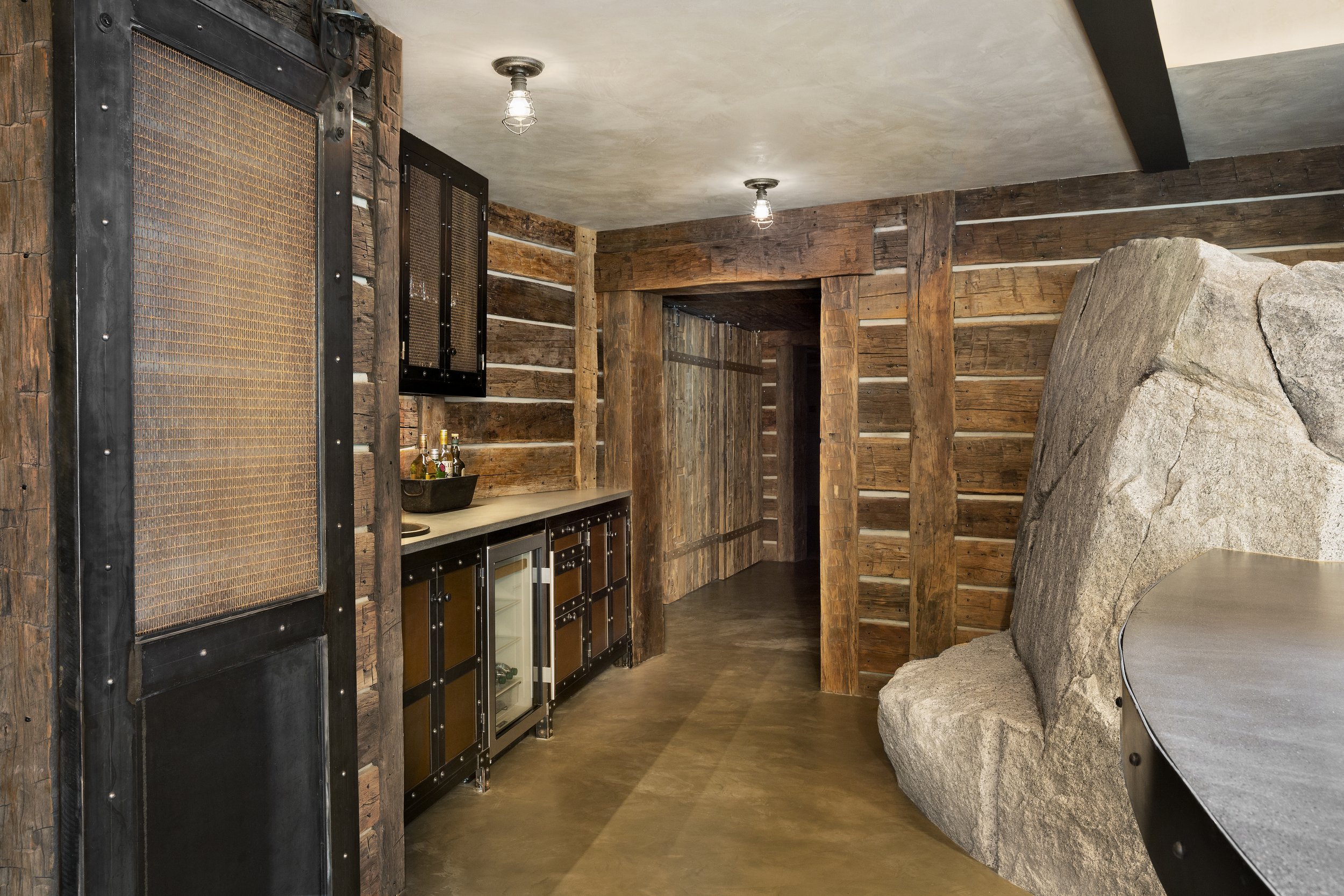 Rustic Modern Bar Area with Exposed Rock in McCall, Idaho Home