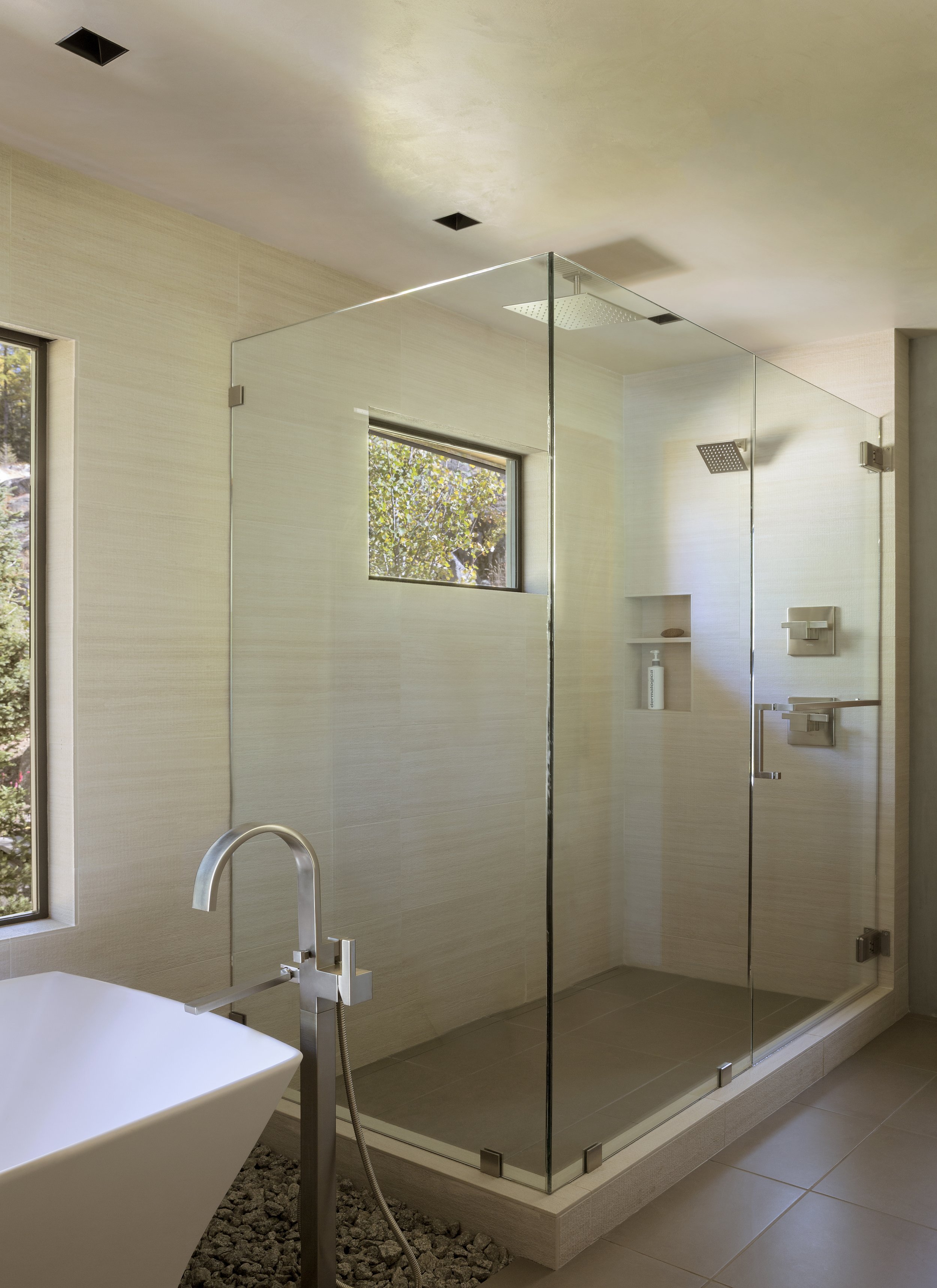 Modern Bathroom with Glass Shower and Forest Views in Idaho Home