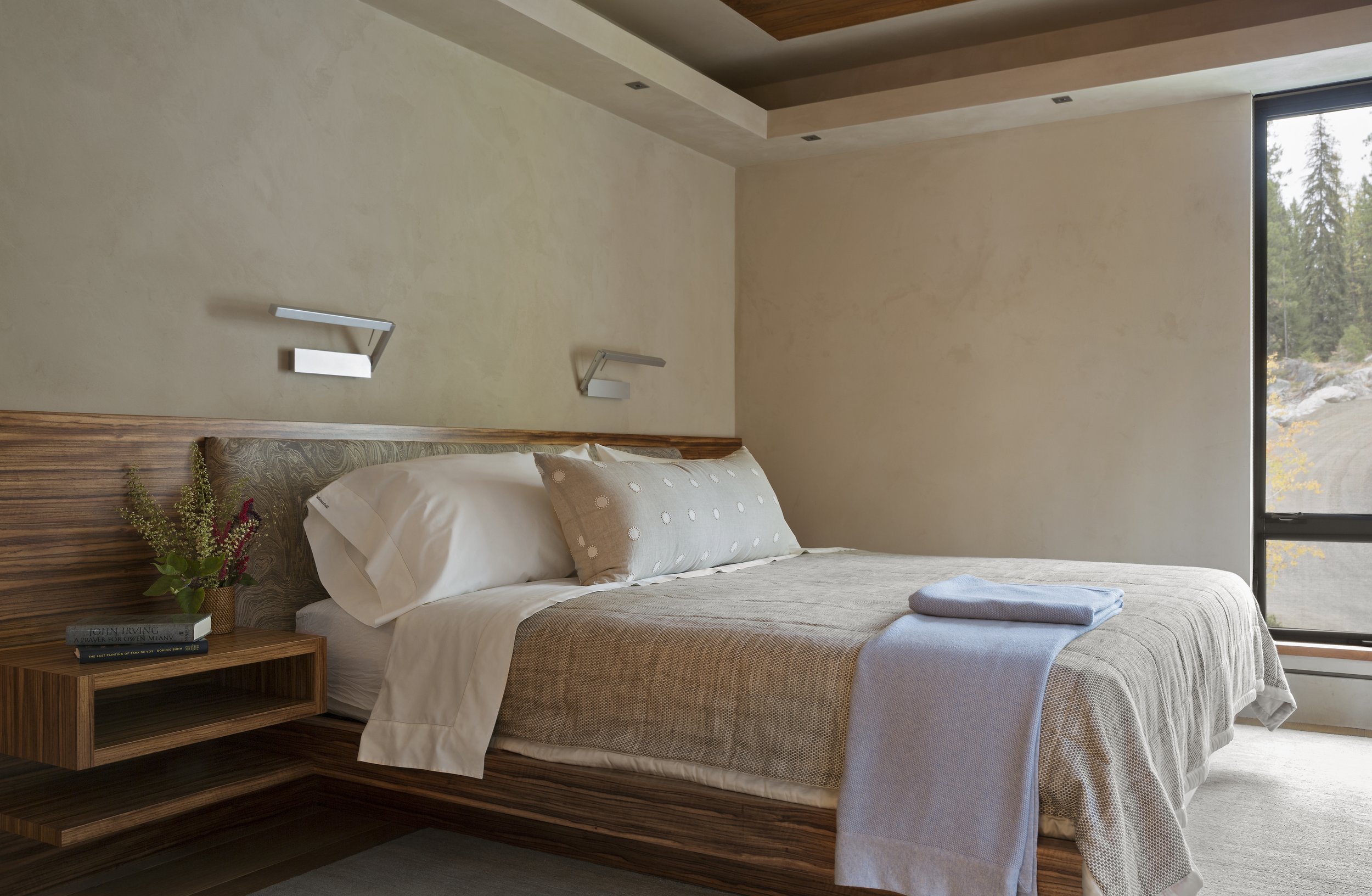 Modern Bedroom with Wooden Headboard and Neutral Bedding in McCall, Idaho Home