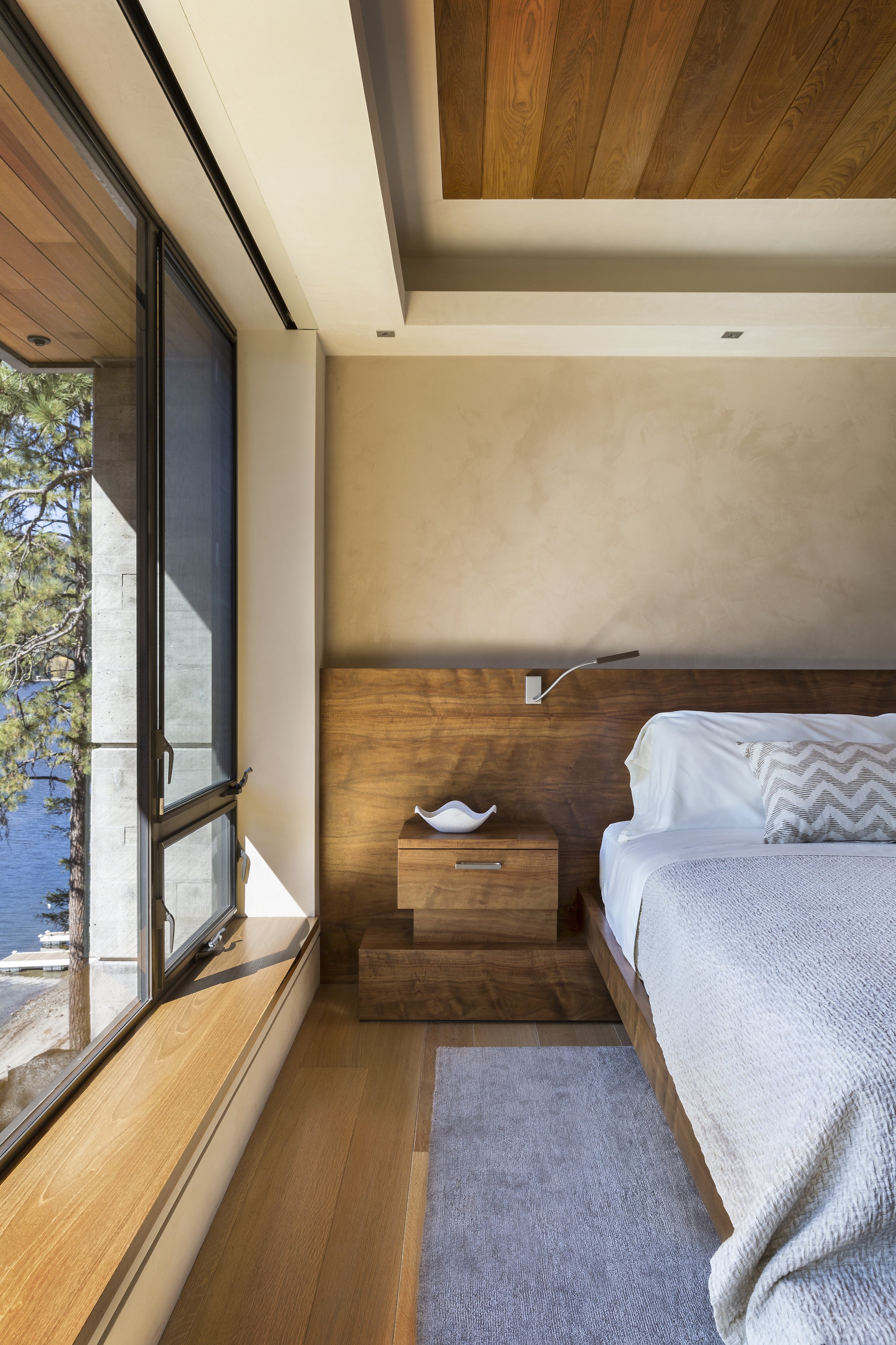 Modern Bedroom with Wood Accents and Lake View in McCall, Idaho Home