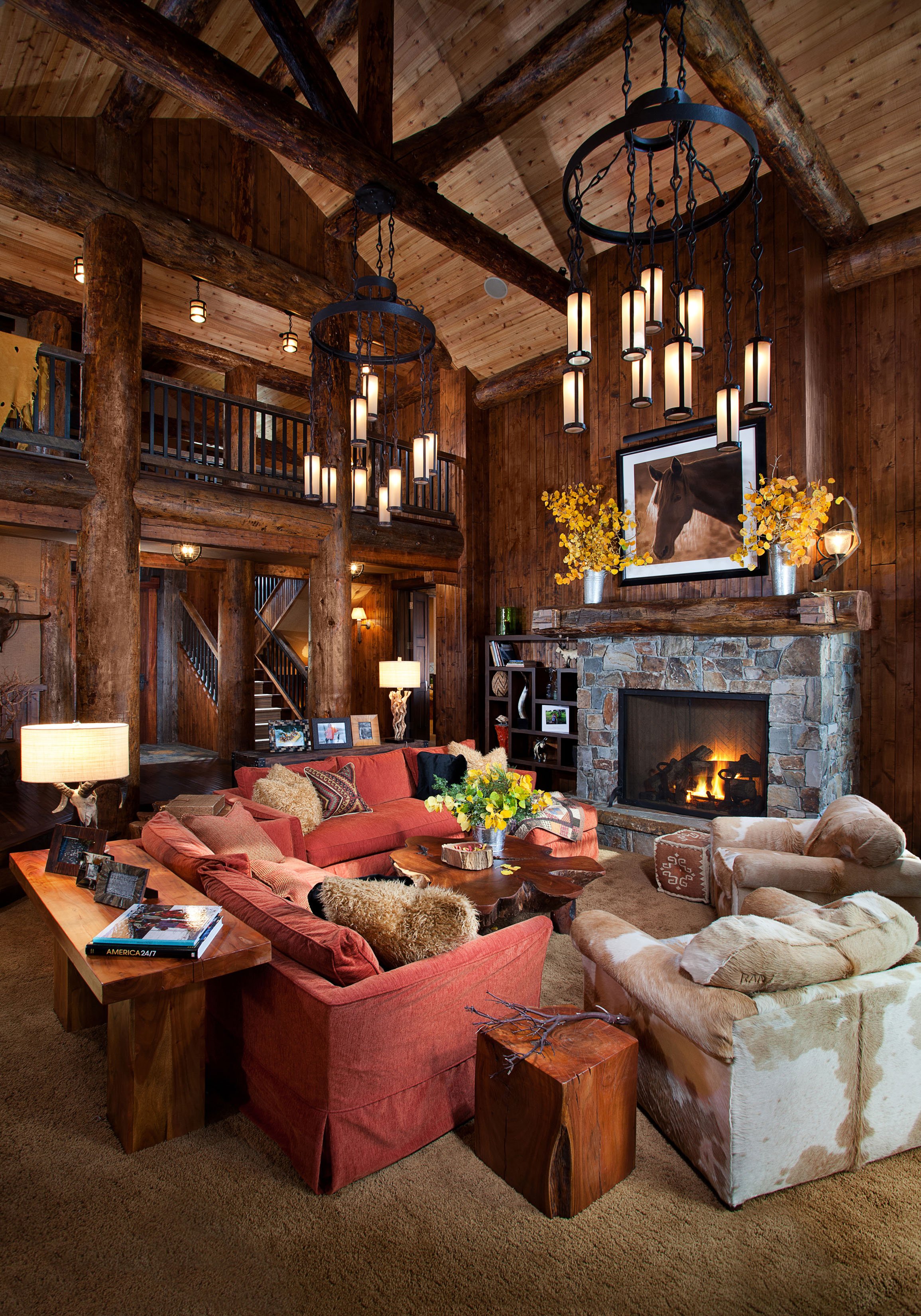 Rustic Living Room with Wooden Beams and Stone Fireplace in Mammoth Lakes, CA