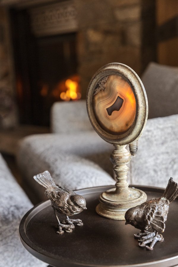 Cozy Fireside Details Candle and Bird Sculpture in Mammoth Lakes, CA
