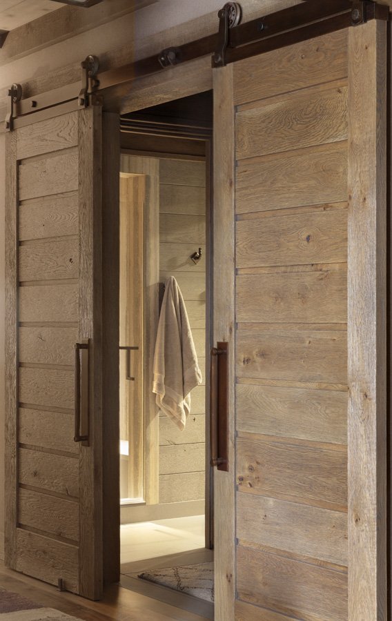 Rustic Sliding Barn Doors Leading to Bathroom in Mammoth Lakes, CA Ski Lodge