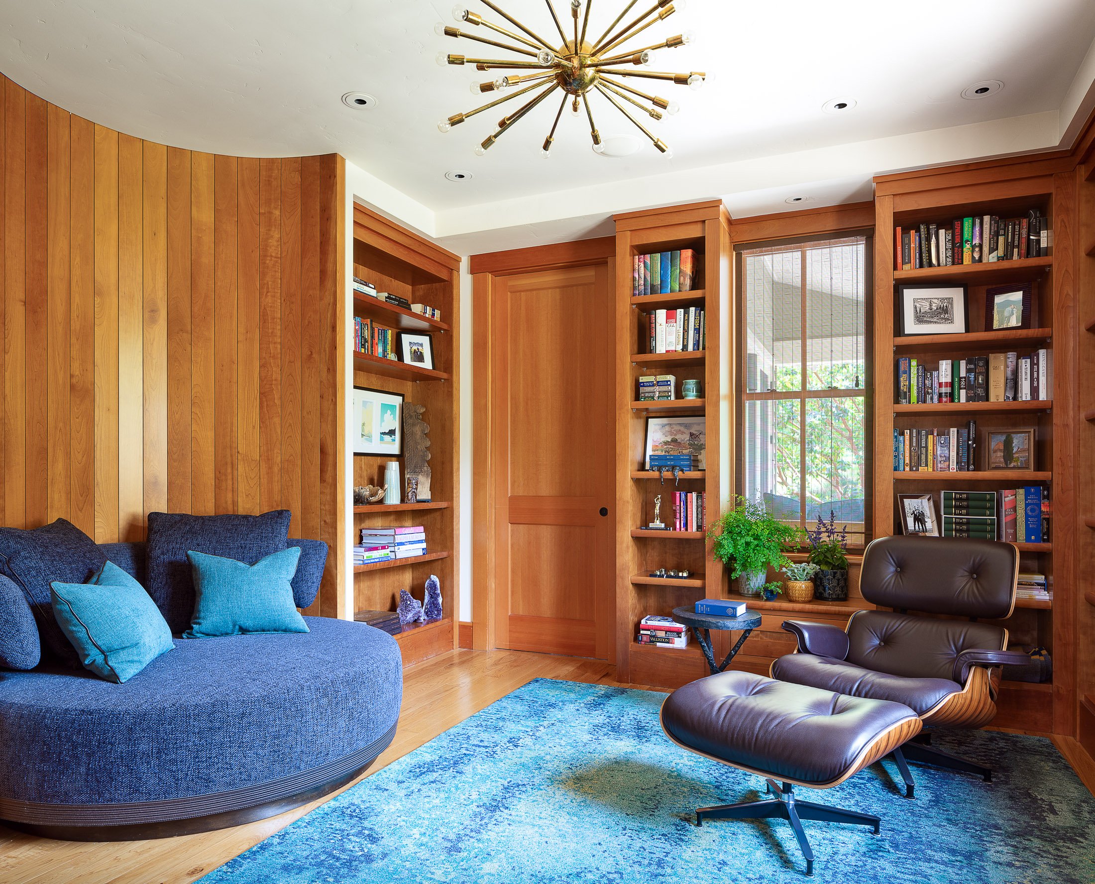 Cozy Home Library with Modern Furniture and Wooden Shelves in Woodside, CA