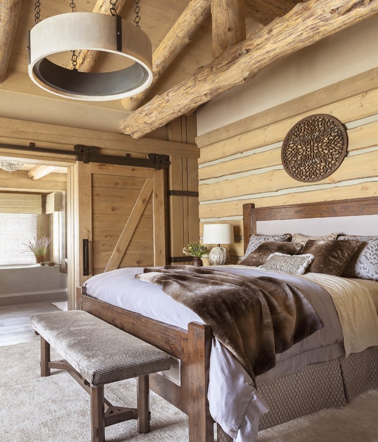 Modern Rustic Bedroom with Large Windows and Fur Bedding in Mammoth Lakes, CA