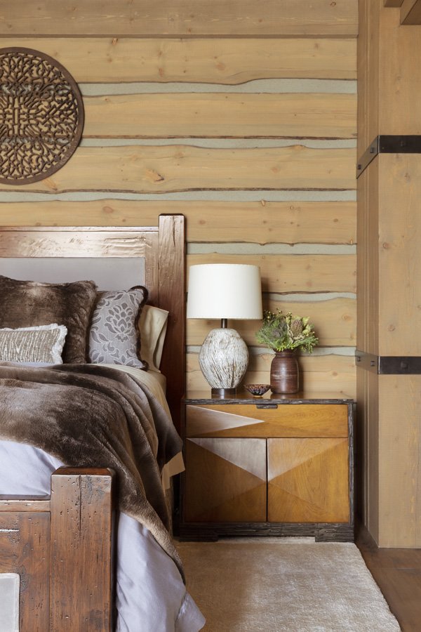 Modern Rustic Bedroom with Large Windows and Fur Bedding in Mammoth Lakes, CA