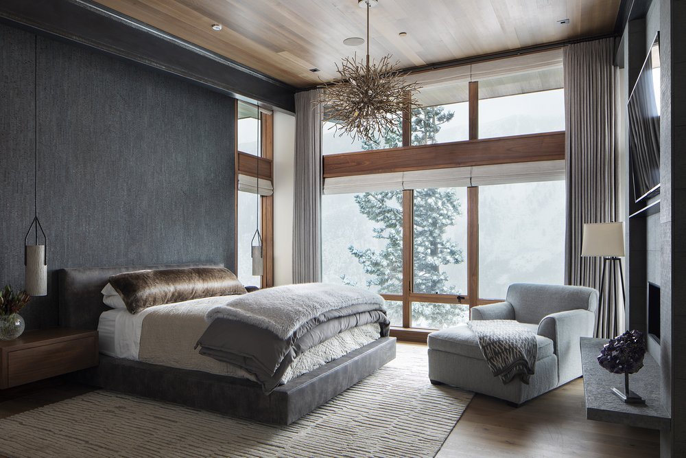 Modern Mountain Bedroom with Large Windows and Fur Bedding in Mammoth Lakes, CA