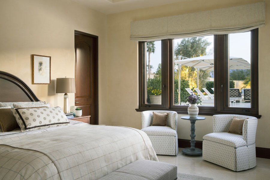 Guest Bedroom with Large Windows and Seating Area in Palm Desert, CA