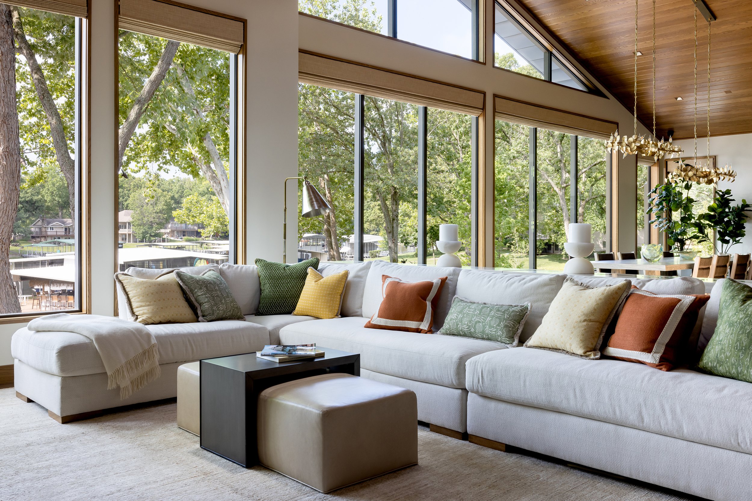 lakefront-modern-living-room-floor-to-ceiling-windows-lake-views.jpg