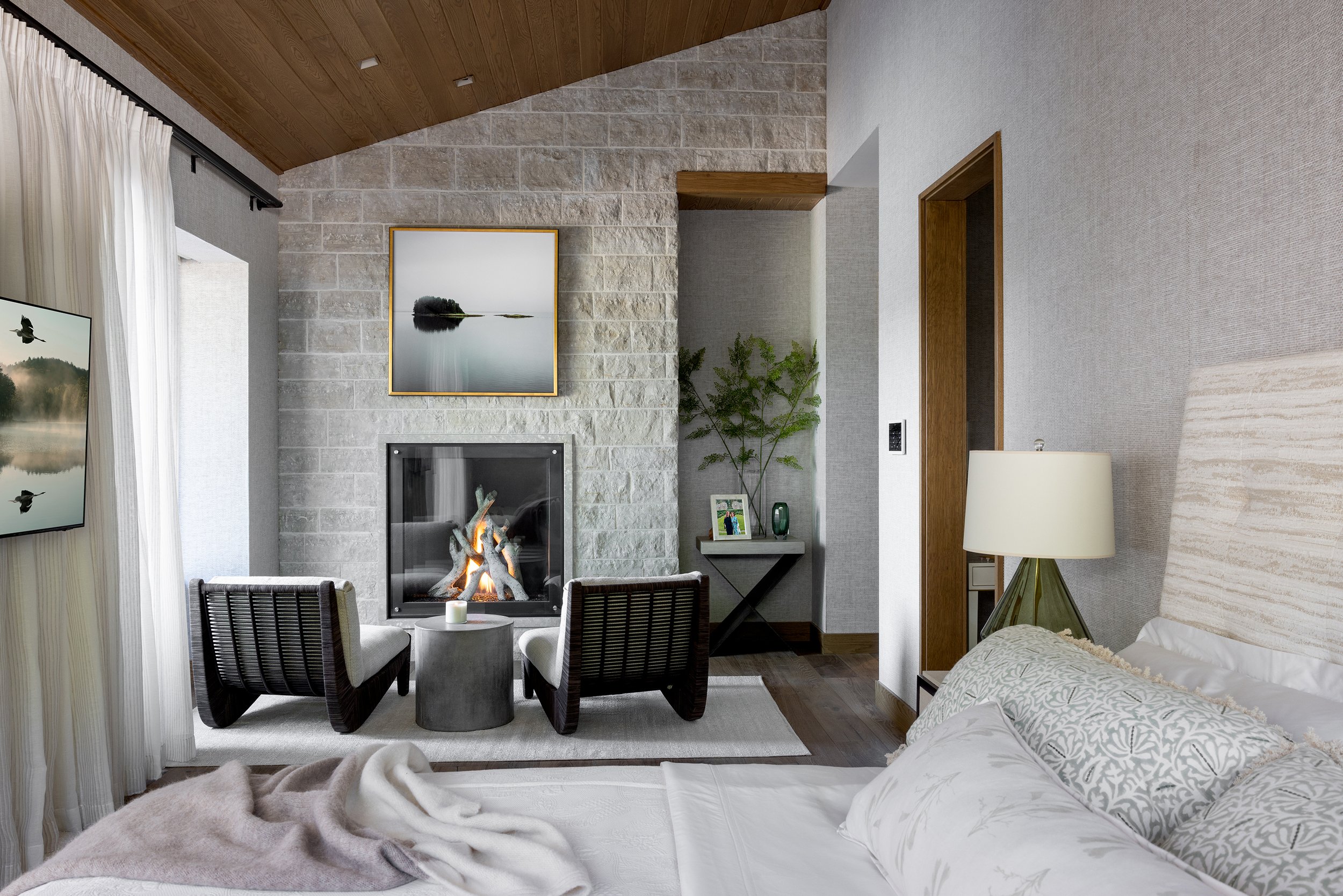 lakefront-primary-bedroom-fireplace-cozy-retreat.jpg